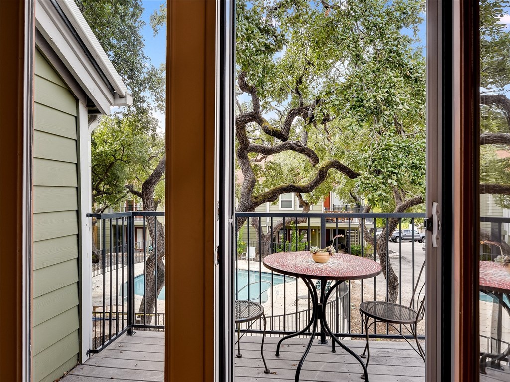 3601 Menchaca Road, Unit 214 Austin, TX 78704 - Photo 1 of 1 Gorgeous French doors allow tons of natural light to flood the living space and looks out over gorgeous trees and the community pool area.