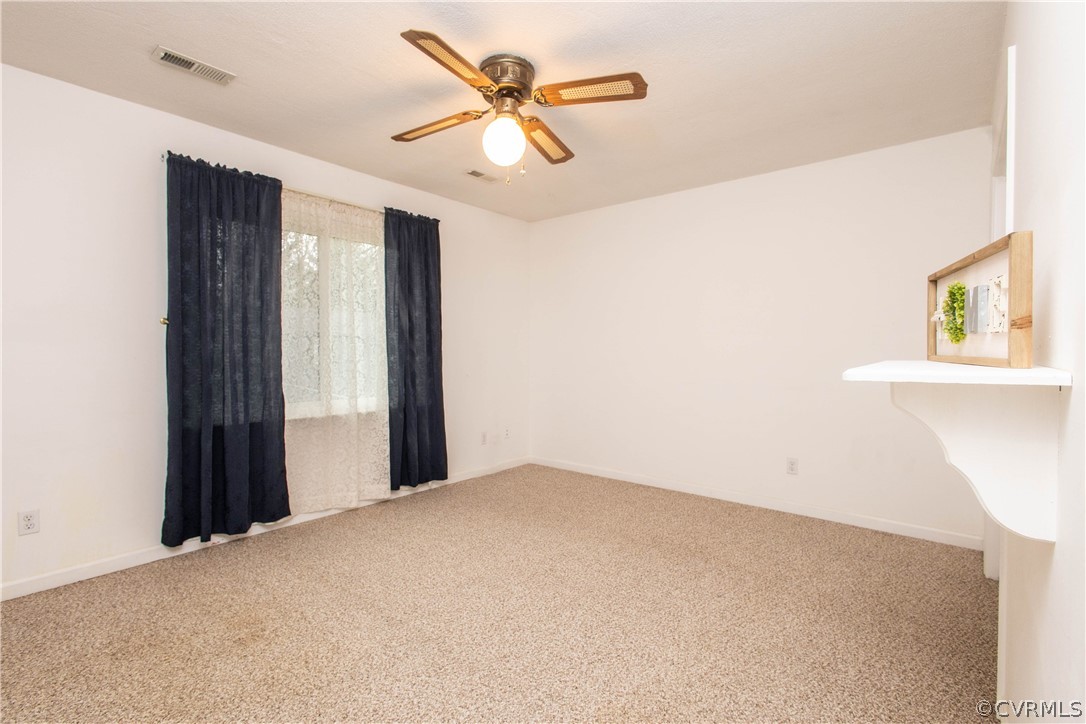 10225 Ridgerun Road Chesterfield, VA 23832 - Photo 17 of 33 a view of a room with a ceiling fan and a window
