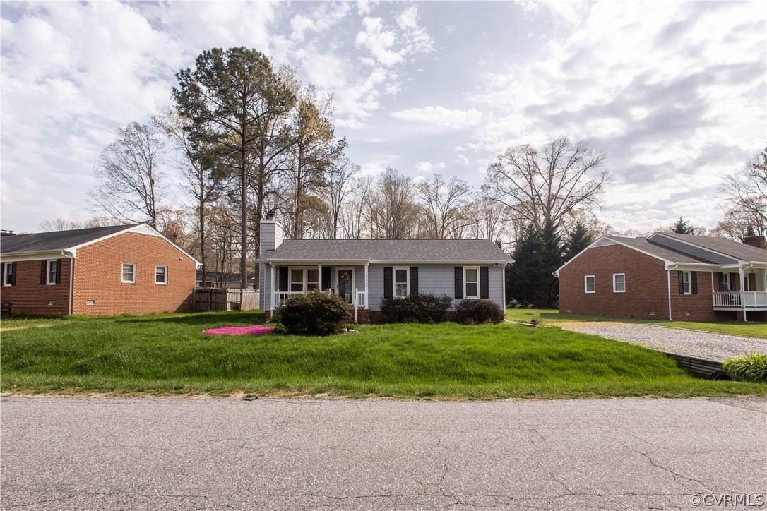 10225 Ridgerun Road Chesterfield, VA 23832 - Photo 9 of 33 a front view of a house with a garden and trees