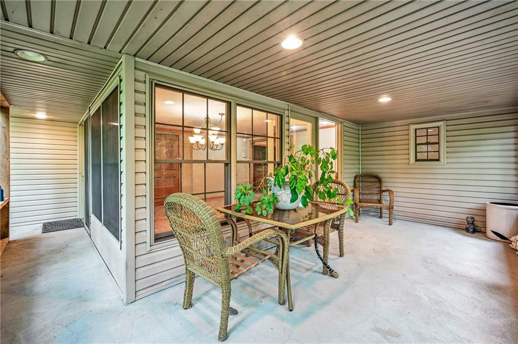 301 Hopper Road Transfer, PA 16154 - Photo 14 of 48 a patio with table and chairs and potted plants