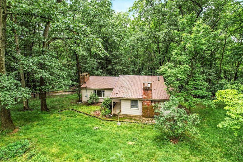 301 Hopper Road Transfer, PA 16154 - Photo 3 of 48 a view of a house with a yard and a tree