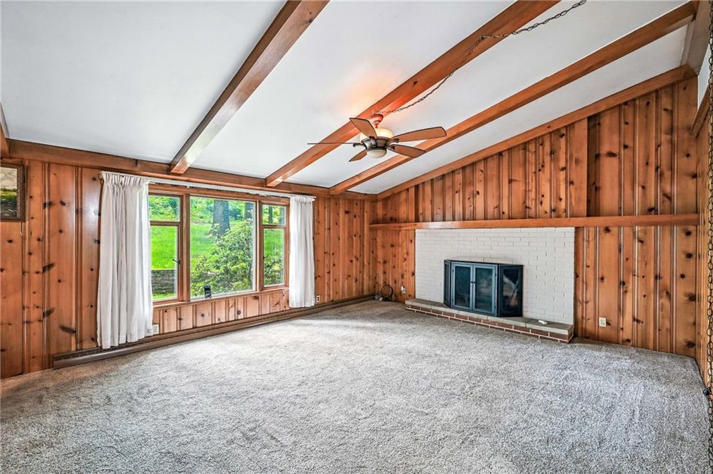 301 Hopper Road Transfer, PA 16154 - Photo 32 of 48 a view of an empty room with a fireplace and a window