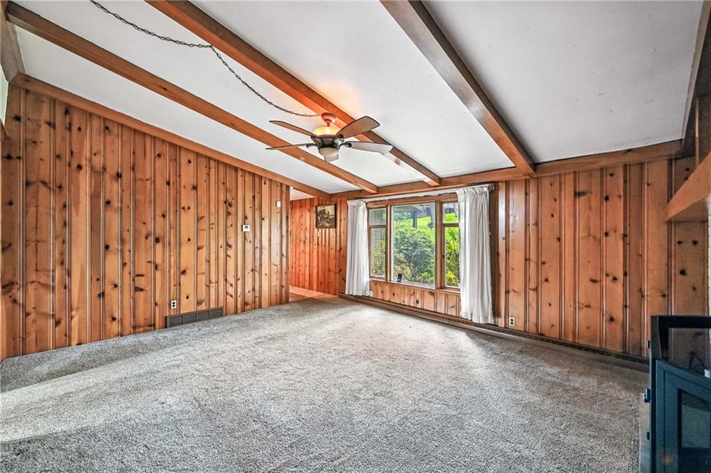 301 Hopper Road Transfer, PA 16154 - Photo 33 of 48 a view of a room with a large window and wooden walls