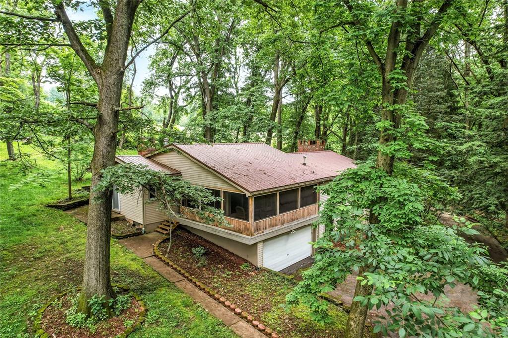 301 Hopper Road Transfer, PA 16154 - Photo 6 of 48 a house with trees in the background