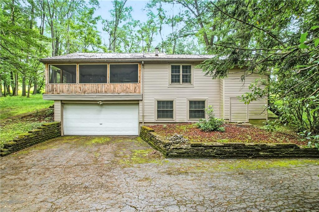 301 Hopper Road Transfer, PA 16154 - Photo 7 of 48 a front view of a house with garden