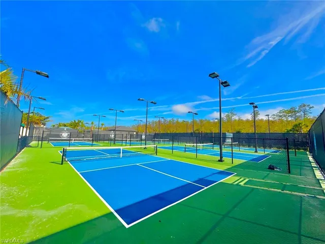 a view of an outdoor space and basketball court