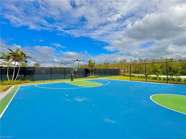 a view of a swimming pool with a yard