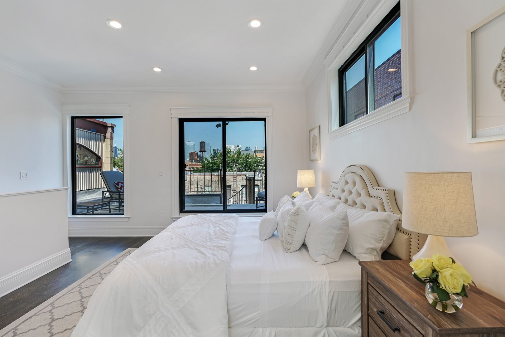 9 North Ada Street Chicago, IL 60607 - Photo 15 of 39 a bedroom with furniture and a large window