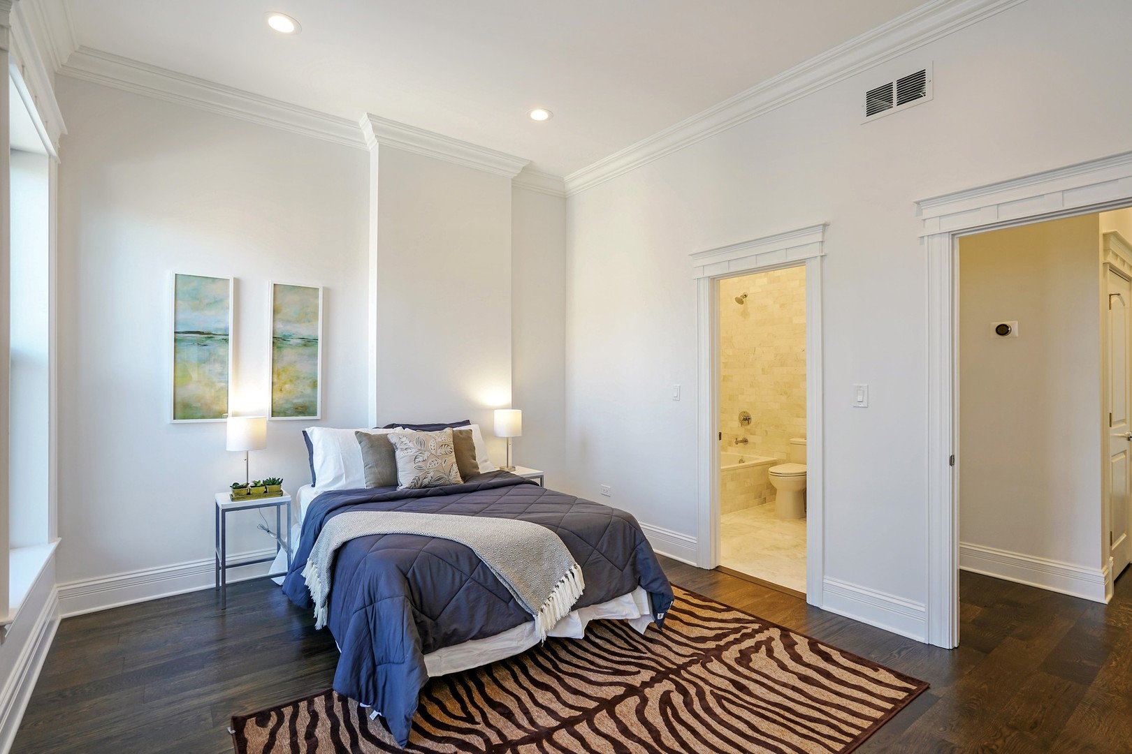 9 North Ada Street Chicago, IL 60607 - Photo 20 of 39 a bedroom with a bed and wooden floor