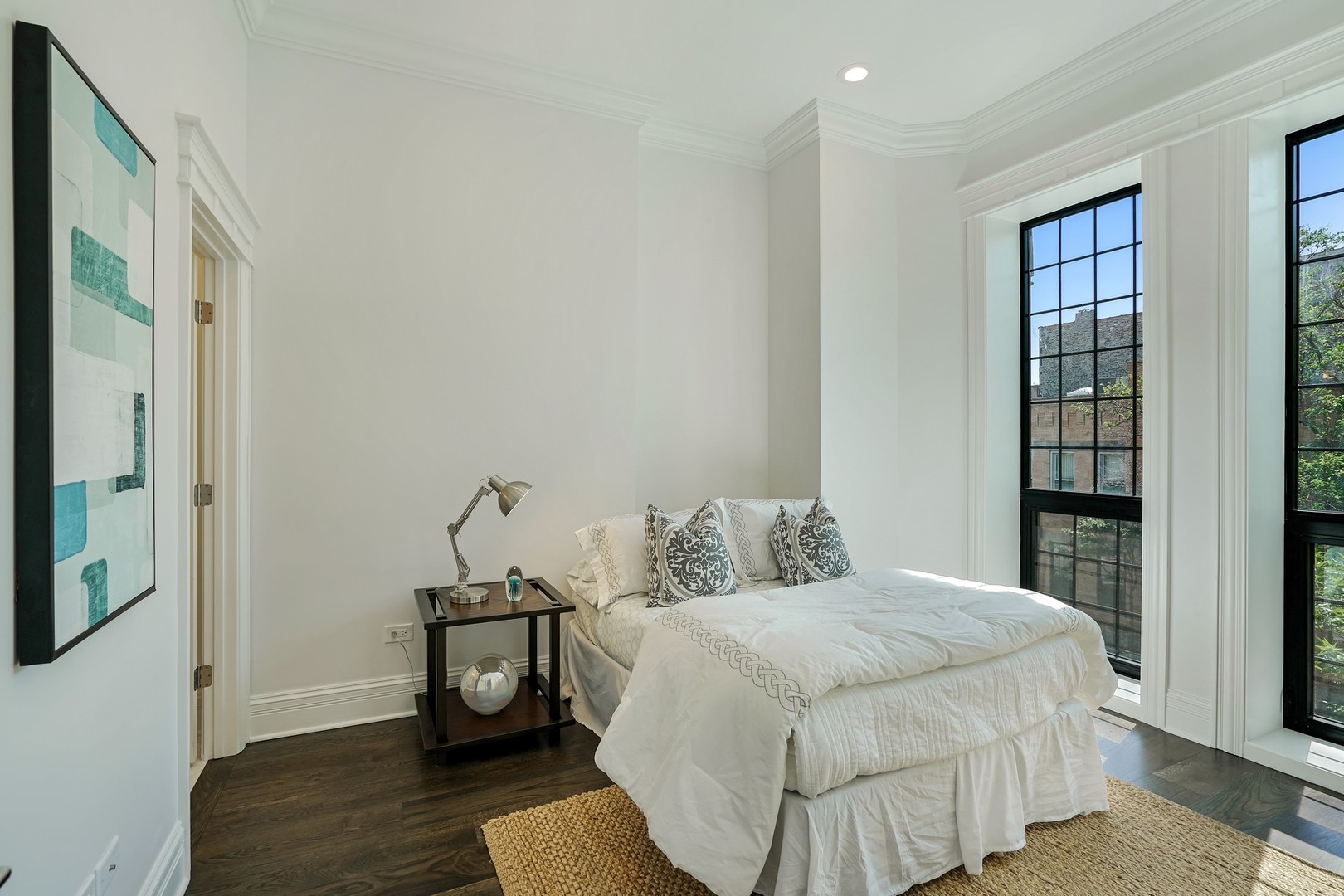 9 North Ada Street Chicago, IL 60607 - Photo 21 of 39 a bedroom with a bed and wooden floor