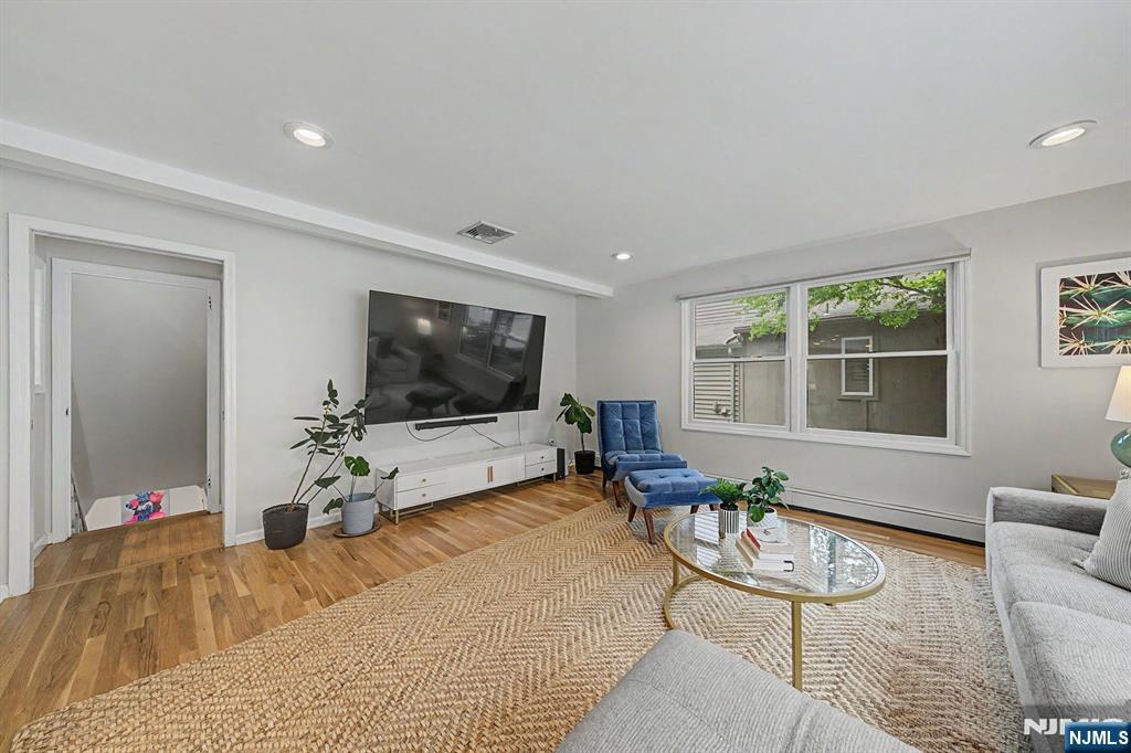 45 Highfield Road Bloomfield, NJ 07003 - Photo 13 of 50 a living room with furniture and a flat screen tv