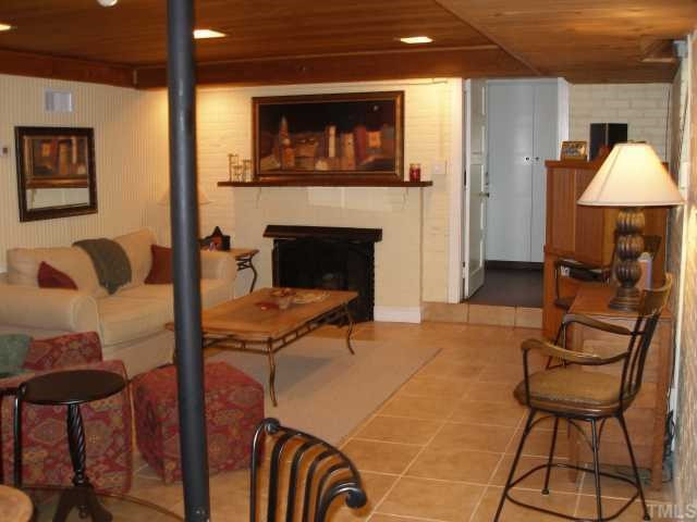 3203 Ruffin Street Raleigh, NC 27607 - Photo 6 of 8 Use this cozy space as a family room, game room, home theatre or as a guest suite. Enjoy cool evenings in front of the gas log fireplace. You'll love the views of the backyard!