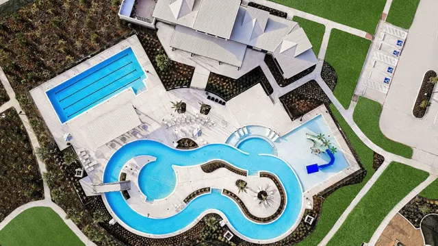 a view of a swimming pool with a lounge chair