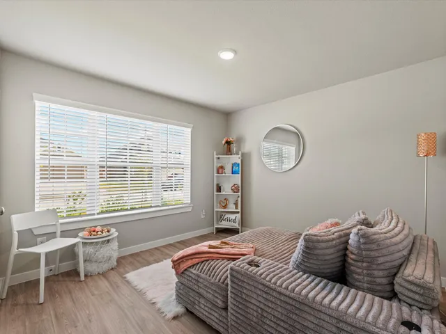 a view of a room with wooden floor