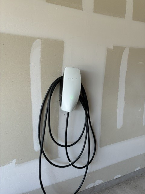 233 Perfect World Loop Jarrell, TX 76537 - Photo 19 of 24 A dedicated charging station provides modern convenience in the garage.