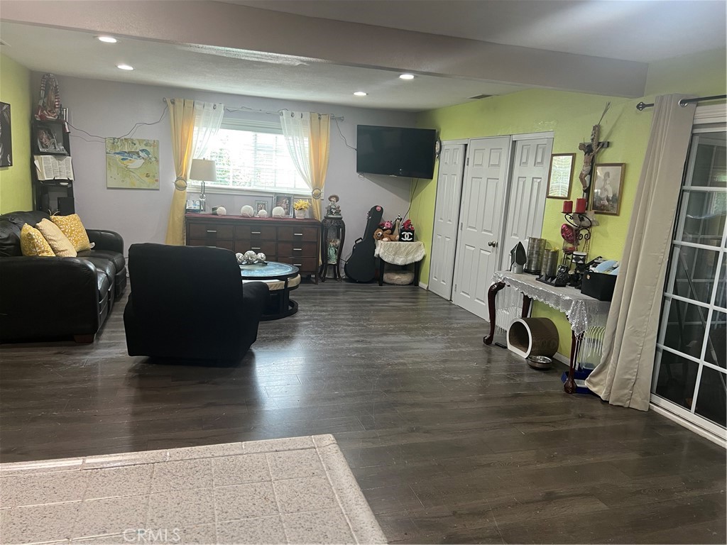 8943 Delano Drive Riverside, CA 92503 - Photo 5 of 11 a living room with furniture and a wooden floor