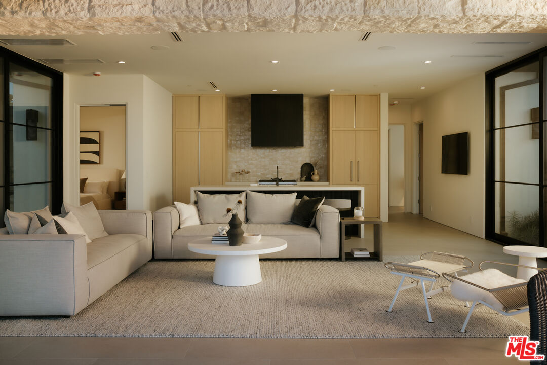 2551 White Stallion Road Thousand Oaks, CA 91361 - Photo 34 of 48 a living room with furniture and a flat screen tv