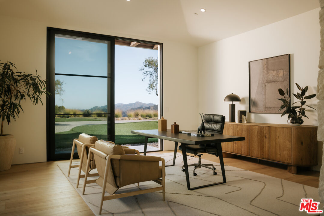 2551 White Stallion Road Thousand Oaks, CA 91361 - Photo 35 of 48 a living room with furniture a large window and a flat screen tv