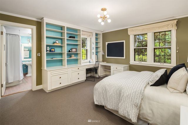 a view of a hallway with entryway and front door