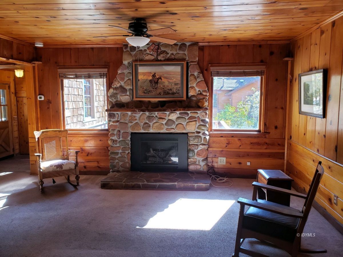 25225 Palomar Road Idyllwild, CA 92549 - Photo 11 of 17 a living room with furniture and a fireplace