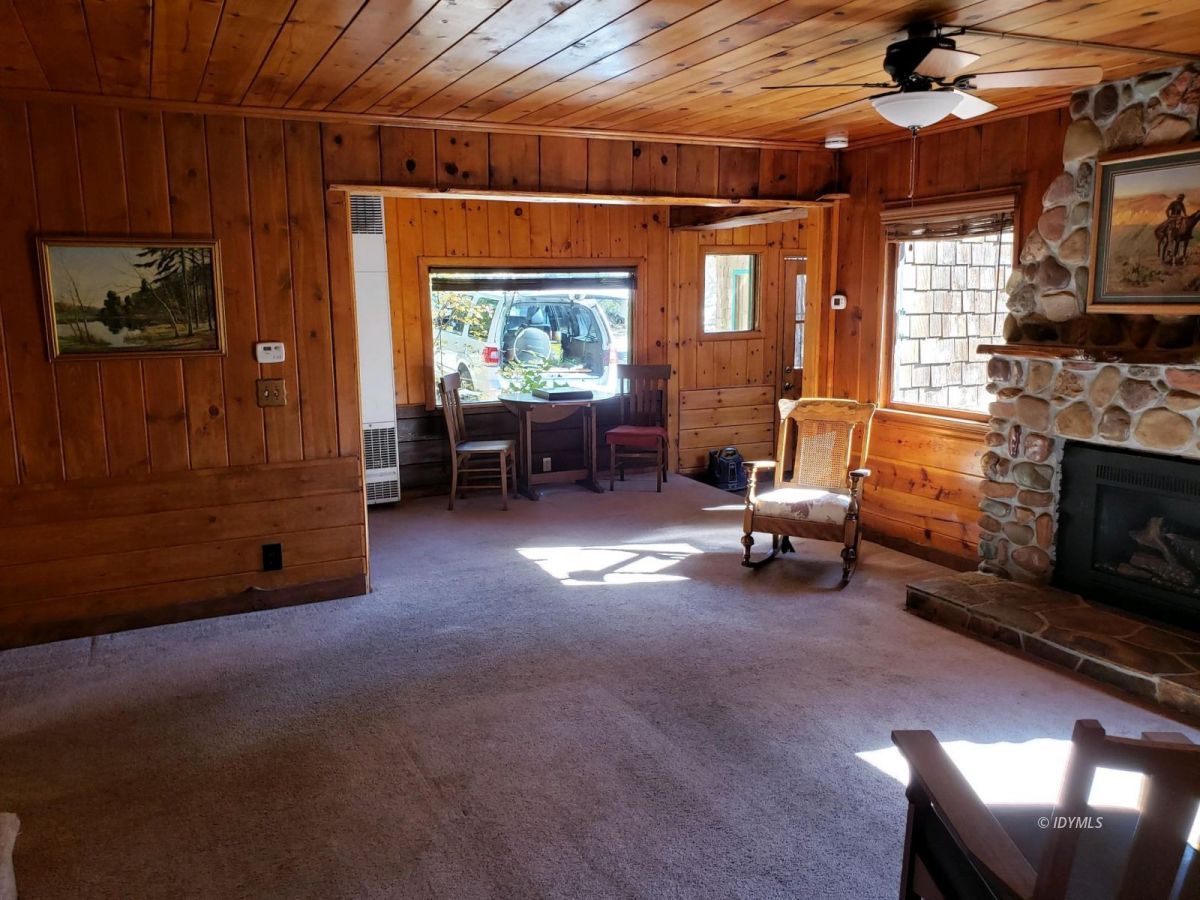 25225 Palomar Road Idyllwild, CA 92549 - Photo 12 of 17 a living room with furniture and a fireplace