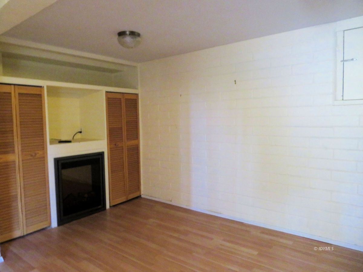 25225 Palomar Road Idyllwild, CA 92549 - Photo 13 of 17 a view of an empty room with wooden floor and a window