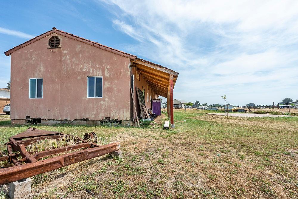 2803 Sharon Boulevard Madera, CA 93638 - Photo 22 of 29 a backyard of a house with barbeque oven and outdoor seating