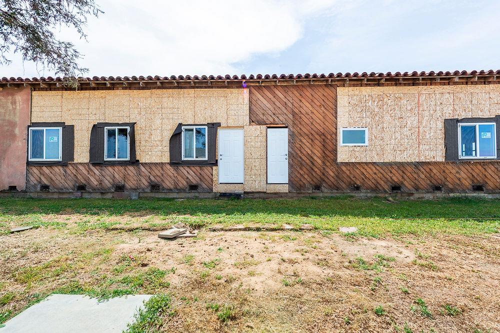 2803 Sharon Boulevard Madera, CA 93638 - Photo 24 of 29 a wooden house with a yard and wooden fence