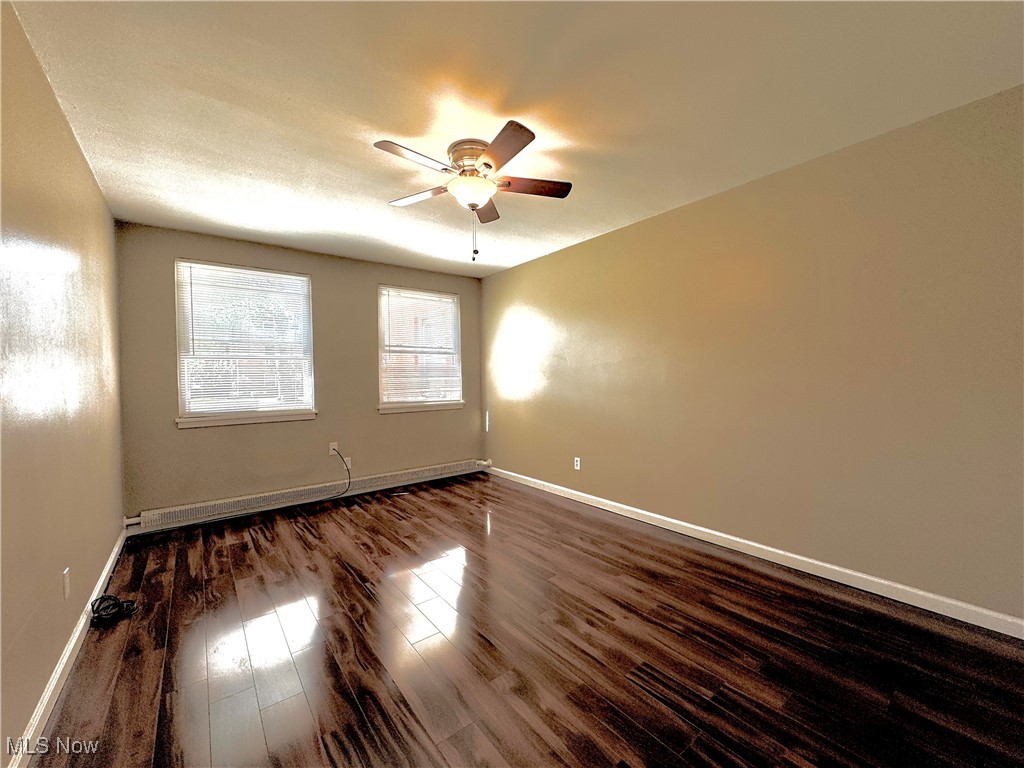 13805 Cedar Road, Unit 103C Cleveland, OH 44118 - Photo 11 of 18 Bedroom with dark wood-style flooring, ceiling fan, and a textured ceiling