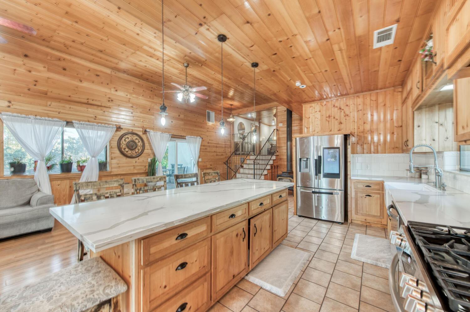 49376 House Ranch Road O'Neals, CA 93645 - Photo 18 of 70 a kitchen with stainless steel appliances granite countertop a stove a sink and a refrigerator