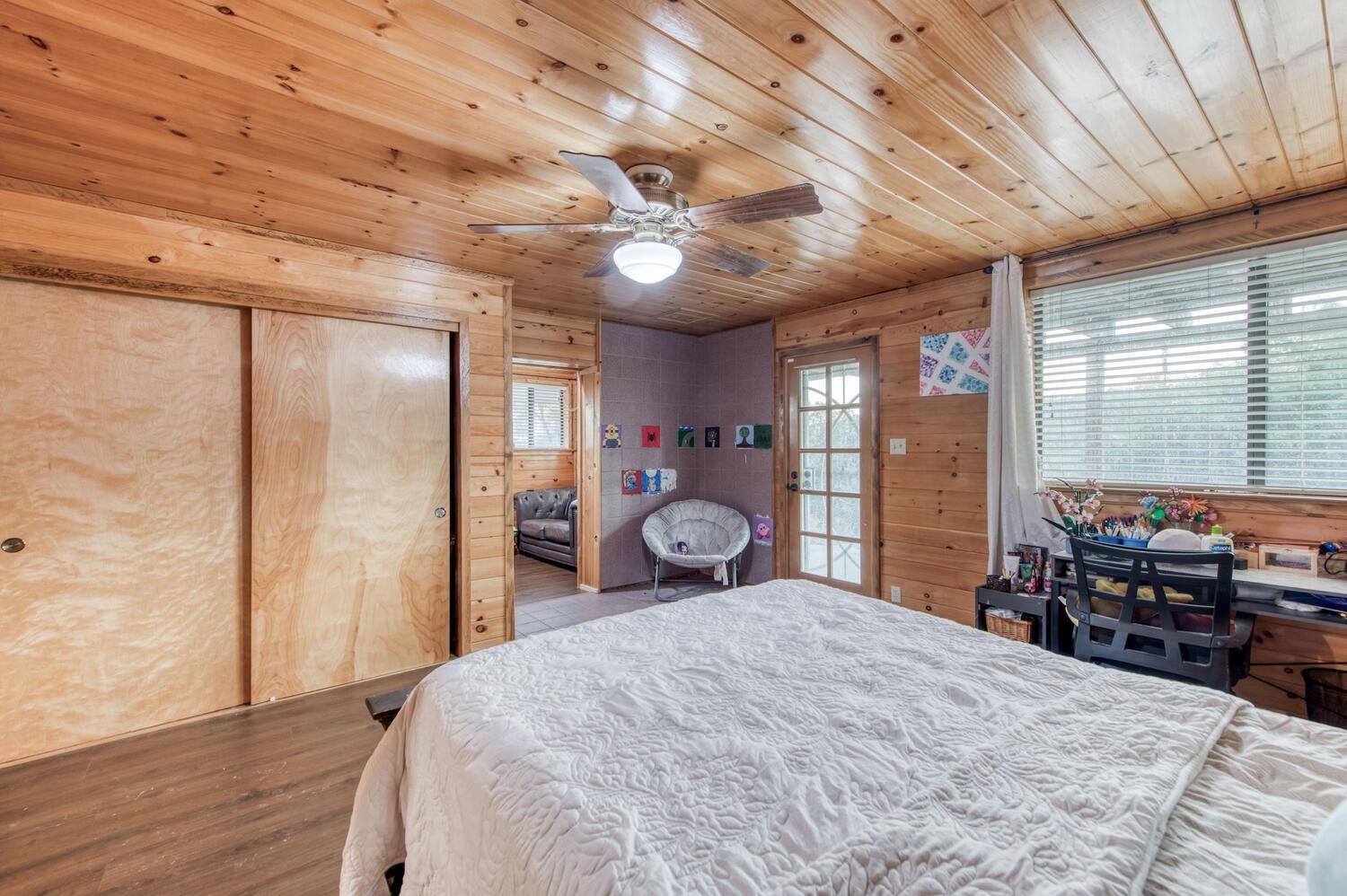 49376 House Ranch Road O'Neals, CA 93645 - Photo 25 of 70 a bedroom with a bed and wooden floor