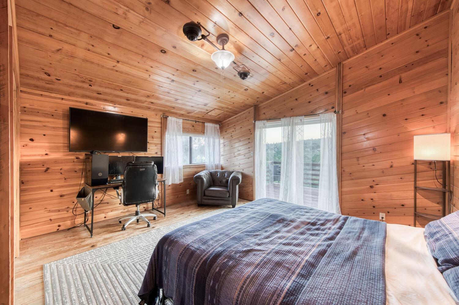 49376 House Ranch Road O'Neals, CA 93645 - Photo 34 of 70 a bedroom with a bed and wooden floor