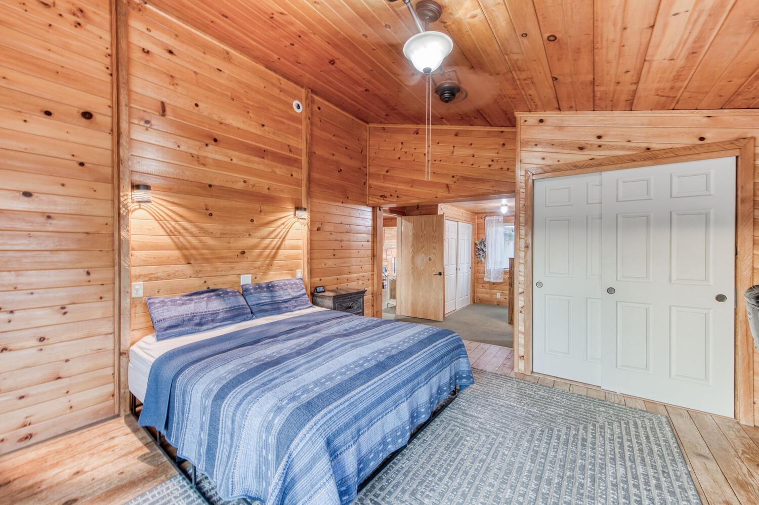 49376 House Ranch Road O'Neals, CA 93645 - Photo 35 of 70 a bedroom with a bed and a night stand