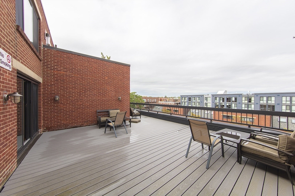 85 Brainerd Road, Unit 503 Boston, MA 02134 - Photo 20 of 21 a view of roof deck with patio
