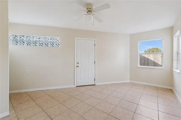 a view of an empty room with a window