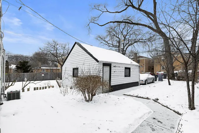 a view of a house covered in snow