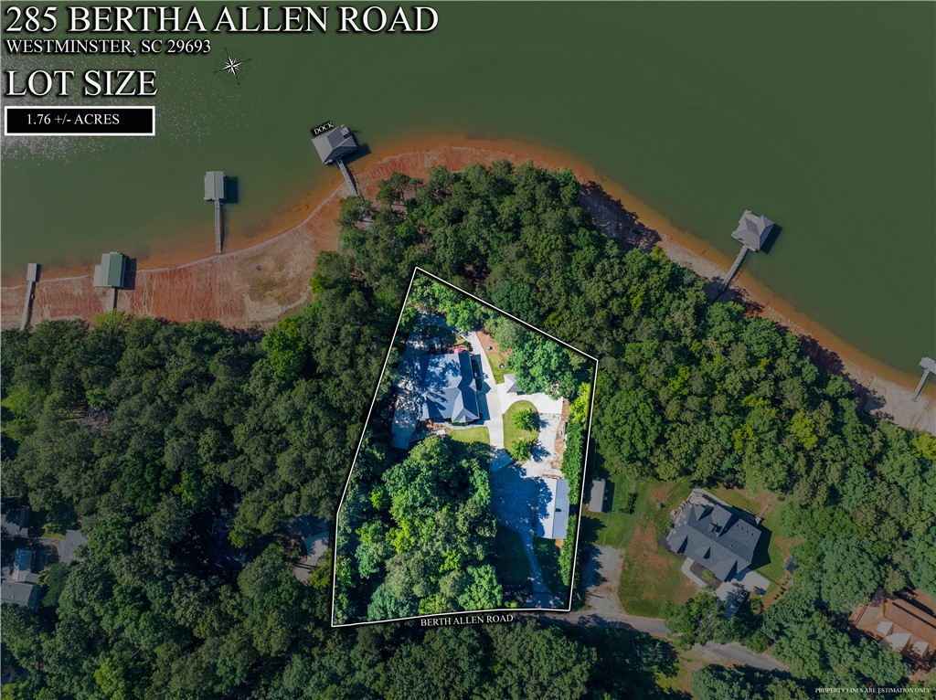 285 Bertha Allen Road Westminster, SC 29693 - Photo 41 of 50 A sprawling lakeside estate with ample acreage and private waterfront access, showcasing lush green surroundings and a tranquil water view.