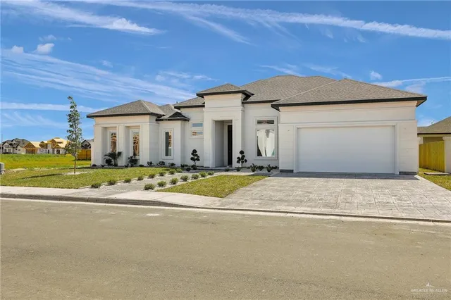 a view of a white house with a outdoor space