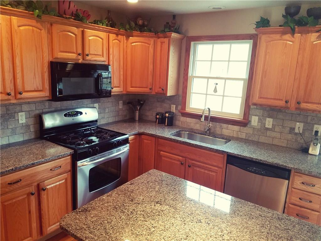 244 North Road Butler, PA 16001 - Photo 7 of 24 Brand new granite counter tops and backsplash.