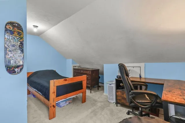 a bedroom with a workspace