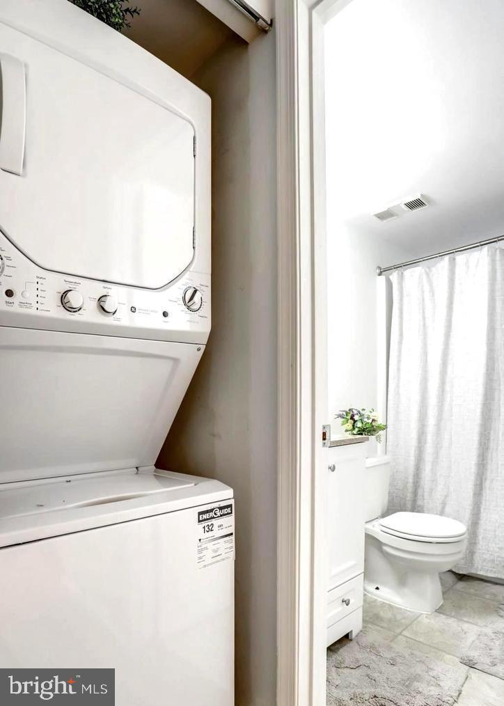 5912 Cove Landing Road, Unit 301 Burke, VA 22015 - Photo 12 of 30 a bathroom with a toilet and a shower
