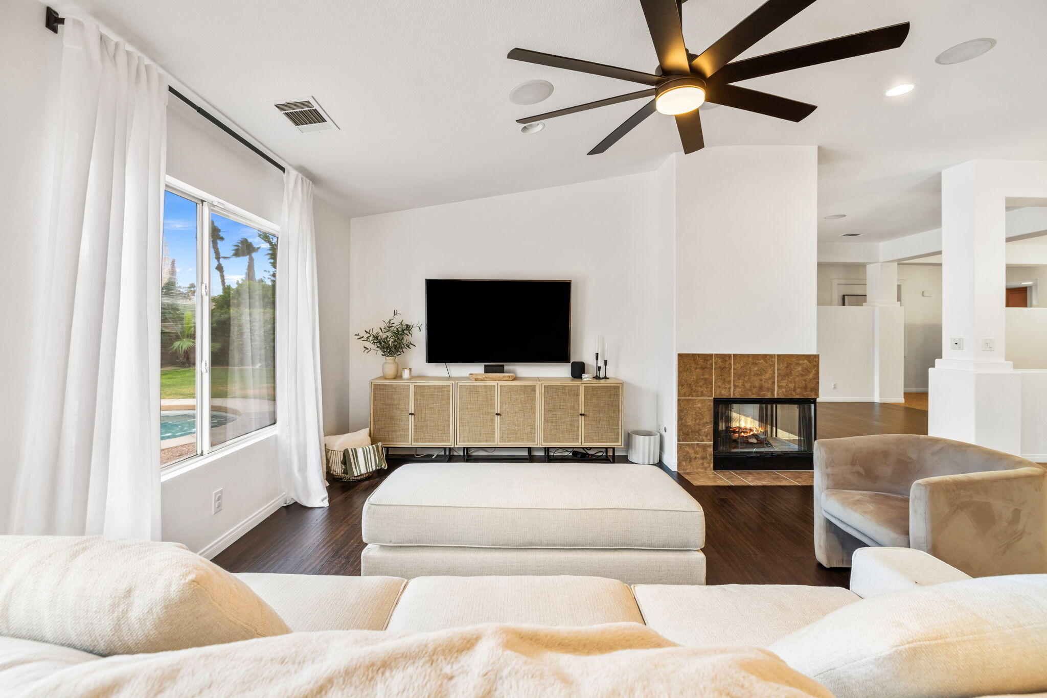 80543 Philadelphia Avenue Indio, CA 92201 - Photo 11 of 46 a living room with couches a flat screen tv and a couch