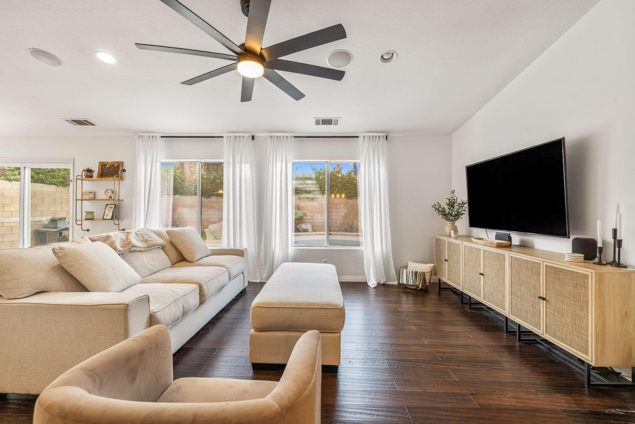 80543 Philadelphia Avenue Indio, CA 92201 - Photo 13 of 46 a living room with furniture and a flat screen tv