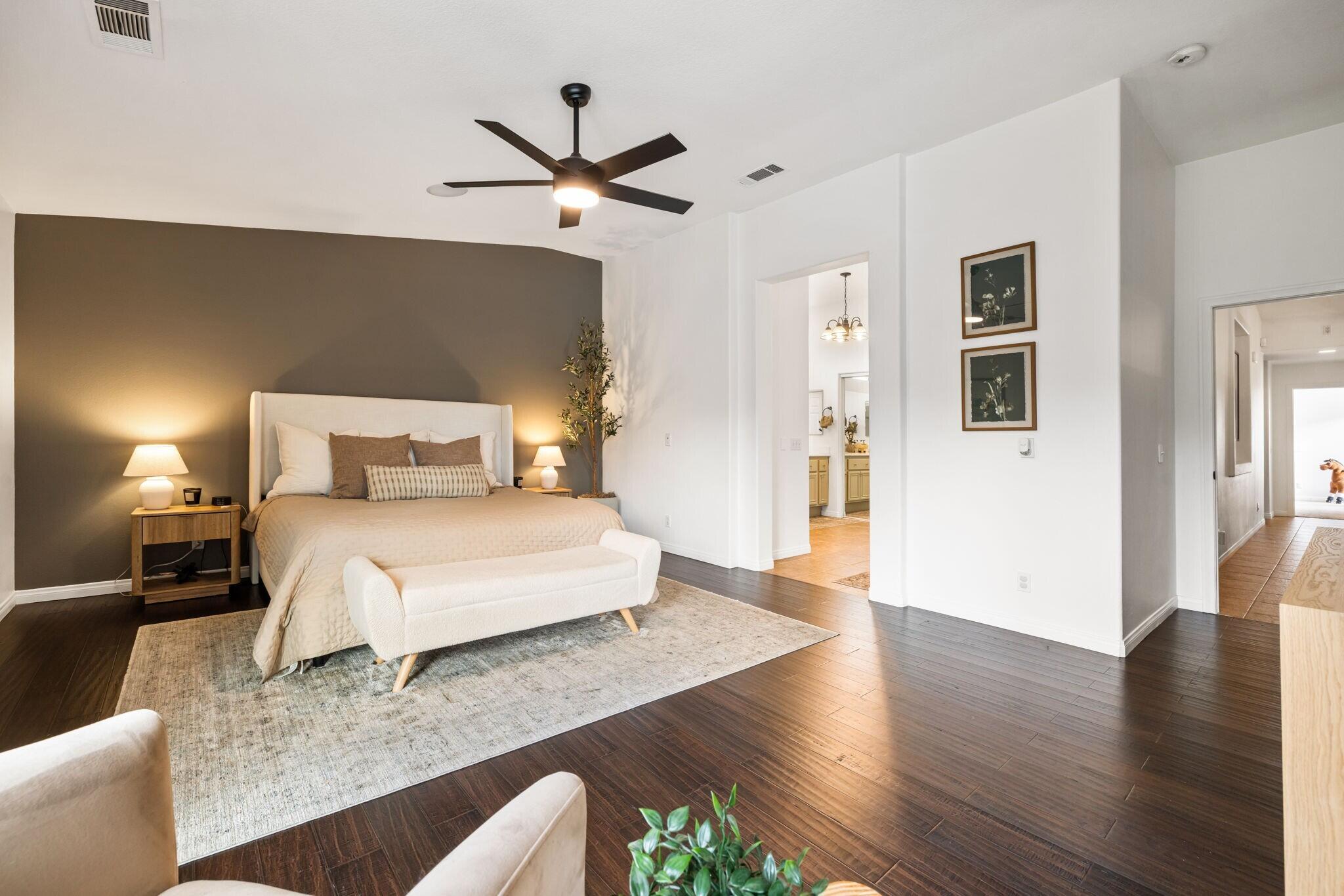 80543 Philadelphia Avenue Indio, CA 92201 - Photo 22 of 46 a bedroom with a bed and wooden floor