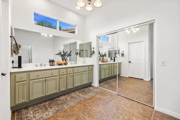 a kitchen with a sink cabinets and appliances