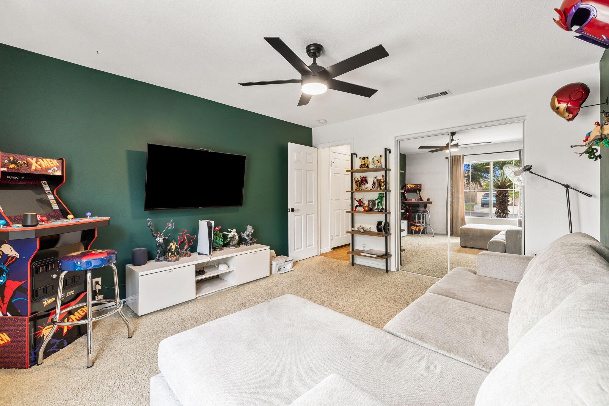 80543 Philadelphia Avenue Indio, CA 92201 - Photo 26 of 46 a living room with furniture and a flat screen tv
