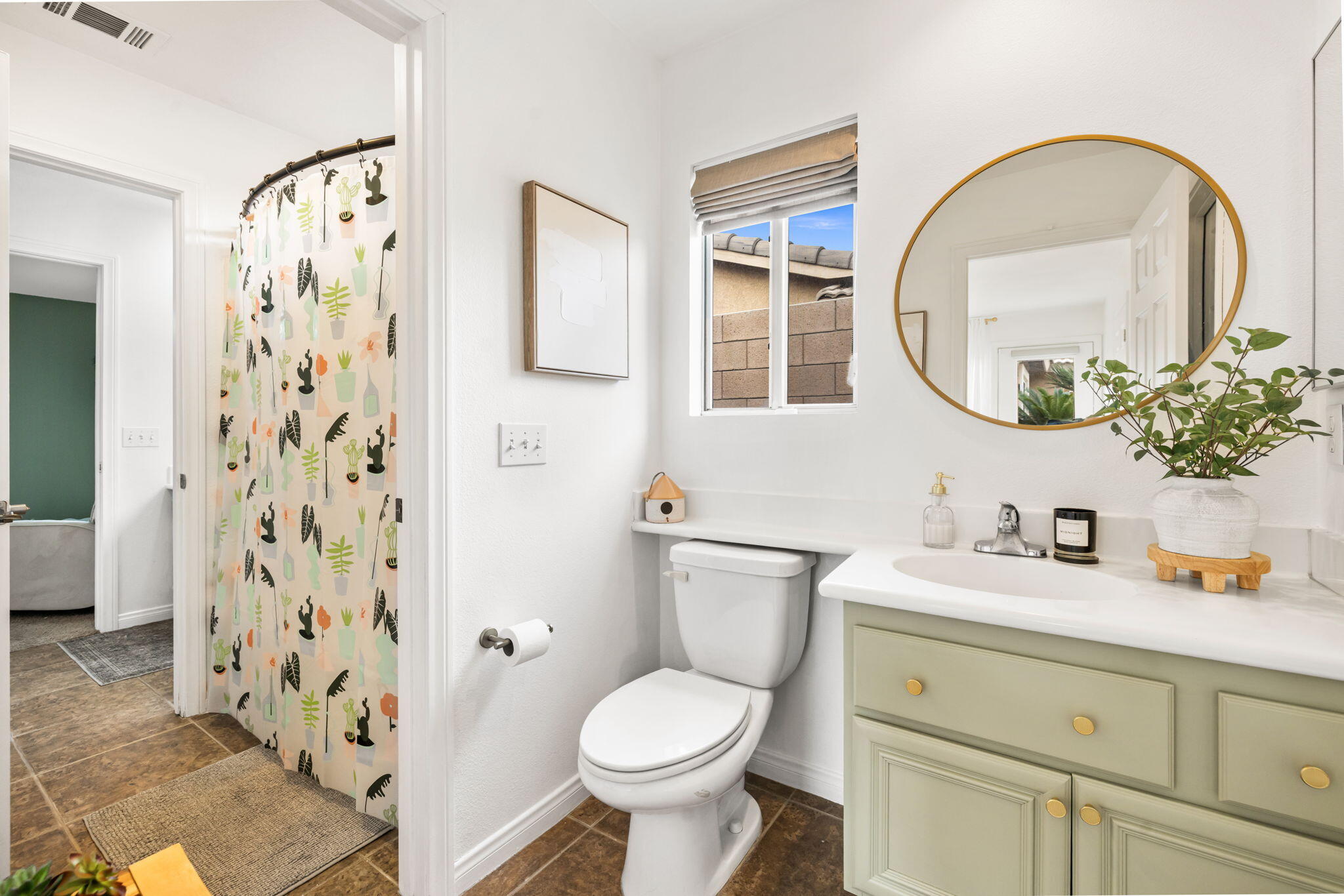 80543 Philadelphia Avenue Indio, CA 92201 - Photo 27 of 46 a bathroom with a toilet sink vanity and mirror