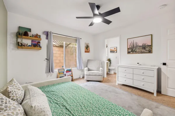 a bedroom with a bed and furniture