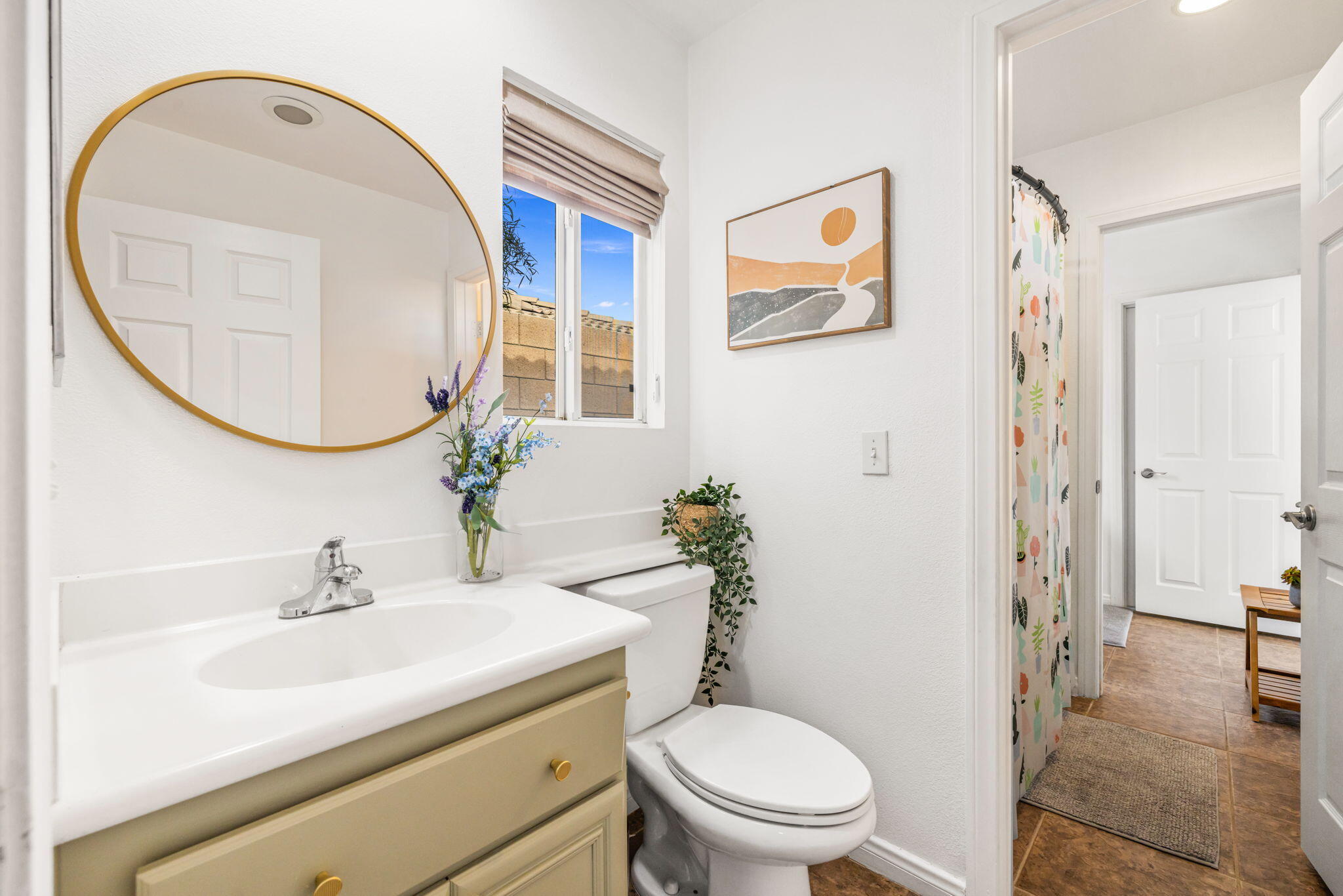 80543 Philadelphia Avenue Indio, CA 92201 - Photo 30 of 46 a bathroom with a sink a mirror a toilet and a mirror