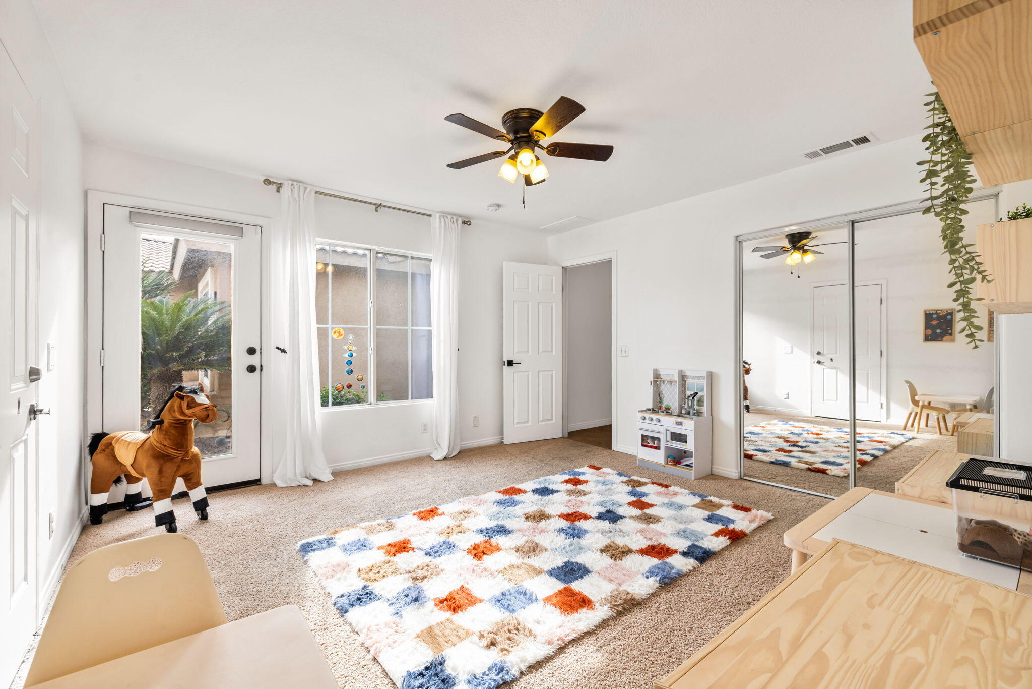 80543 Philadelphia Avenue Indio, CA 92201 - Photo 31 of 46 a bedroom with a bed and a chandelier